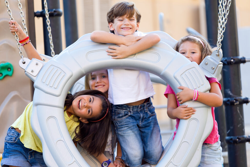 group of childrens having fun in the park.